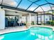 Relaxing pool area with covered patio and pool lift at 15503 Corona Del Mar Dr, Wimauma, FL 33598