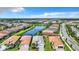 Aerial view of community featuring single-Gathering homes and waterways at 15503 Corona Del Mar Dr, Wimauma, FL 33598