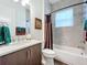 Updated bathroom with tub, shower, and modern vanity at 15503 Corona Del Mar Dr, Wimauma, FL 33598