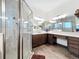 Modern bathroom with a large walk-in shower and updated cabinetry at 15503 Corona Del Mar Dr, Wimauma, FL 33598