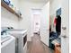 Laundry room with washer, dryer, and access to a half bathroom at 15503 Corona Del Mar Dr, Wimauma, FL 33598