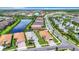 Aerial view of a beautiful community with houses, streets, and a lake at 15503 Corona Del Mar Dr, Wimauma, FL 33598