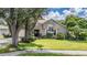 House exterior with landscaping and driveway at 6536 Northlake Dr, Zephyrhills, FL 33542