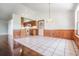 Bright dining area with wood flooring and adjacent kitchen at 6536 Northlake Dr, Zephyrhills, FL 33542