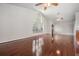 Spacious living room featuring hardwood floors and a large window at 6536 Northlake Dr, Zephyrhills, FL 33542