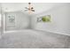 Large bedroom with carpeted floors and ceiling fan at 6536 Northlake Dr, Zephyrhills, FL 33542