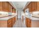 Kitchen with wood cabinets and modern appliances at 6536 Northlake Dr, Zephyrhills, FL 33542
