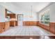 Spacious dining area with wood accents and tile floors at 6536 Northlake Dr, Zephyrhills, FL 33542