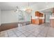 Bright dining area with tile floors and kitchen access at 6536 Northlake Dr, Zephyrhills, FL 33542