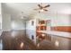 Bright living room with hardwood floors and high ceilings at 6536 Northlake Dr, Zephyrhills, FL 33542