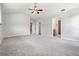 Large main bedroom with carpeted floors and access to bathroom at 6536 Northlake Dr, Zephyrhills, FL 33542