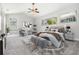 Main bedroom with staged furniture and carpet at 6536 Northlake Dr, Zephyrhills, FL 33542