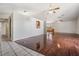 Hardwood floor living room with tile entryway and kitchen views at 6536 Northlake Dr, Zephyrhills, FL 33542