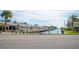 Waterfront homes with private boat docks and lush landscaping at 1555 Tarpon Center Dr # 136, Venice, FL 34285