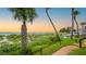 Beach access with walkway and lush vegetation at 1555 Tarpon Center Dr # 136, Venice, FL 34285