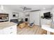 Small living room with a sofa, chairs, and a murphy bed at 1555 Tarpon Center Dr # 136, Venice, FL 34285