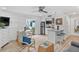 Open living room and kitchenette with sliding door to patio at 1555 Tarpon Center Dr # 136, Venice, FL 34285