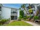 Ground level condo with private patio and lush landscaping at 1555 Tarpon Center Dr # 136, Venice, FL 34285