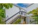 Exterior view of a two story building with stairs leading to the entrance at 1555 Tarpon Center Dr # 136, Venice, FL 34285