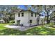 Two-story house with a patio and grassy yard at 6902 E 29Th Ave, Tampa, FL 33619