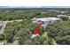 Property located near industrial area, surrounded by trees at 6902 E 29Th Ave, Tampa, FL 33619