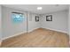 Simple bedroom with light gray walls and wood-look flooring at 6902 E 29Th Ave, Tampa, FL 33619