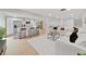 Modern kitchen with white cabinets, marble island, and stainless steel appliances at 6902 E 29Th Ave, Tampa, FL 33619