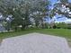 Large backyard with grassy area and a brick patio at 6902 E 29Th Ave, Tampa, FL 33619