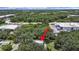 Property located near industrial area, surrounded by trees at 6902 E 29Th Ave, Tampa, FL 33619