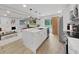 Sleek kitchen with marble island, stainless steel appliances, and ample cabinet space at 6902 E 29Th Ave, Tampa, FL 33619