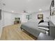 Large main bedroom with a king-size bed and TV at 6902 E 29Th Ave, Tampa, FL 33619