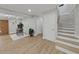 Bright interior hallway with hardwood floors and white doors at 6902 E 29Th Ave, Tampa, FL 33619