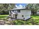 Two-story home with a modern farmhouse exterior at 6902 E 29Th Ave, Tampa, FL 33619