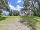 Large grassy backyard behind two-story house at 6902 E 29Th Ave, Tampa, FL 33619