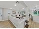 Open concept living room features a large sectional sofa and flows into the kitchen at 6902 E 29Th Ave, Tampa, FL 33619