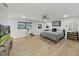 Large main bedroom with a king-size bed and TV at 6902 E 29Th Ave, Tampa, FL 33619