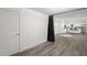 Open dining area with kitchen view, grey flooring, and black curtain at 2395 19Th St, Sarasota, FL 34234