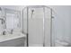 Bathroom with grey vanity, quartz countertop, and shower at 2395 19Th St, Sarasota, FL 34234