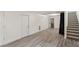Spacious basement with gray vinyl plank flooring and plenty of natural light at 2395 19Th St, Sarasota, FL 34234