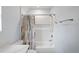 Clean bathroom with shower/tub combo, white vanity, and patterned shower curtain at 2395 19Th St, Sarasota, FL 34234