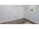 Simple bedroom with grey walls and wood-look floors at 2395 19Th St, Sarasota, FL 34234