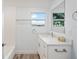 Clean bathroom with white vanity, quartz countertop, and bathtub at 2395 19Th St, Sarasota, FL 34234