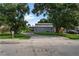 House exterior with a gray barn-style garage in the back at 2395 19Th St, Sarasota, FL 34234