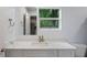 Bathroom with white vanity and quartz countertop at 2395 19Th St, Sarasota, FL 34234