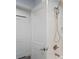 Updated bathroom with shower, white tile, and brushed gold fixtures at 2395 19Th St, Sarasota, FL 34234