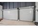 Garage with two roll-up doors and ample storage space at 2395 19Th St, Sarasota, FL 34234