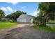 New gray metal three-car garage with extra storage at 2395 19Th St, Sarasota, FL 34234