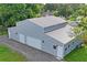 Aerial view of a new gray metal three-car garage at 2395 19Th St, Sarasota, FL 34234