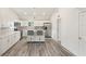 Modern kitchen with white cabinets, quartz countertops, and breakfast bar at 2395 19Th St, Sarasota, FL 34234