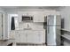Modern kitchen with white cabinets and quartz countertops at 2395 19Th St, Sarasota, FL 34234